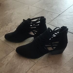 Sleek Black Ankle Boots with Geometric Cutouts and Lace-Up Front